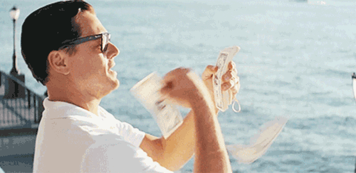 Leo DiCaprio from Wolf of Wall street flinging hundred dollar bills into the water.